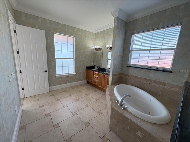 full bathroom featuring crown molding, baseboards, a jetted tub, and vanity