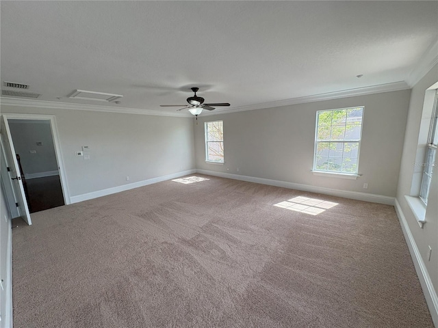 empty room featuring baseboards, ornamental molding, and carpet floors