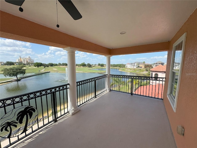 balcony with a water view and a sunroom