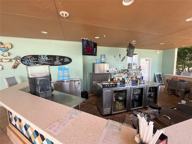 bar featuring a bar and recessed lighting