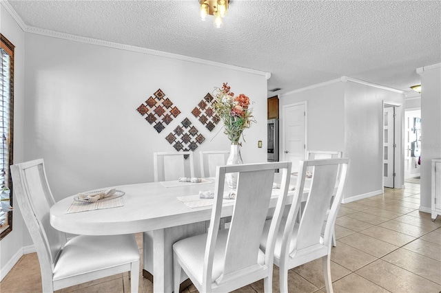 dining area featuring ornamental molding, light tile patterned floors, and a textured ceiling