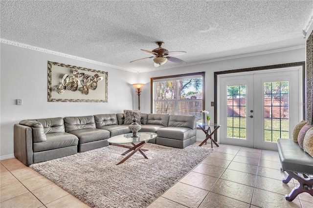 living room with french doors, ornamental molding, a ceiling fan, and plenty of natural light