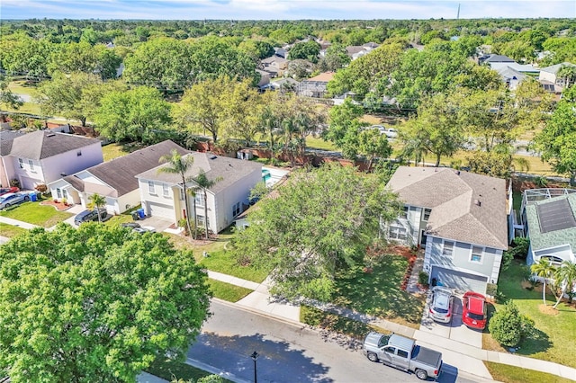 birds eye view of property with a wooded view and a residential view