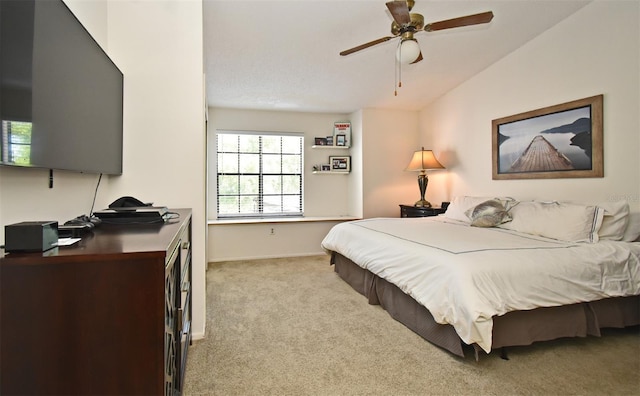 carpeted bedroom featuring baseboards and vaulted ceiling