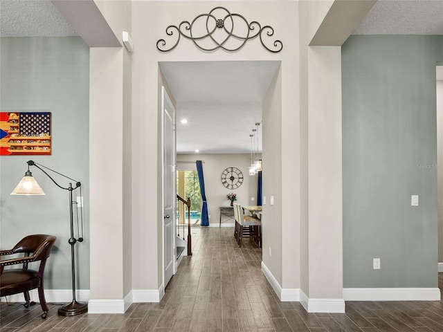 corridor with baseboards and dark wood-style flooring
