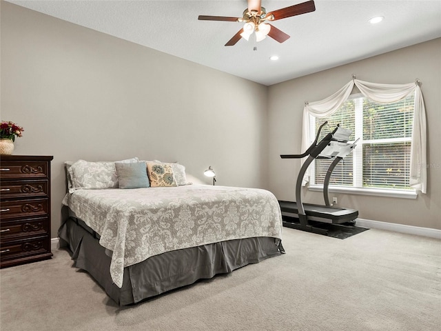 carpeted bedroom featuring recessed lighting, baseboards, and ceiling fan
