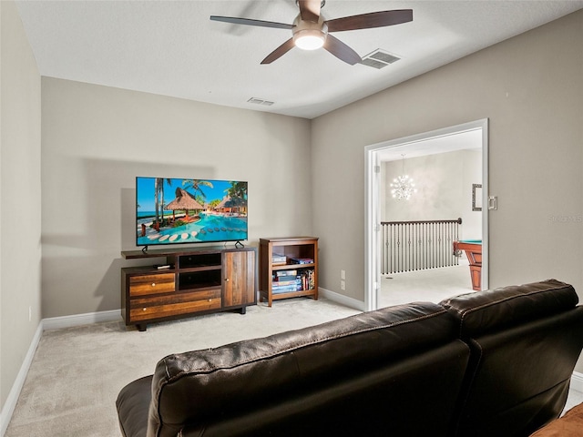 living room featuring carpet floors, visible vents, a ceiling fan, and baseboards