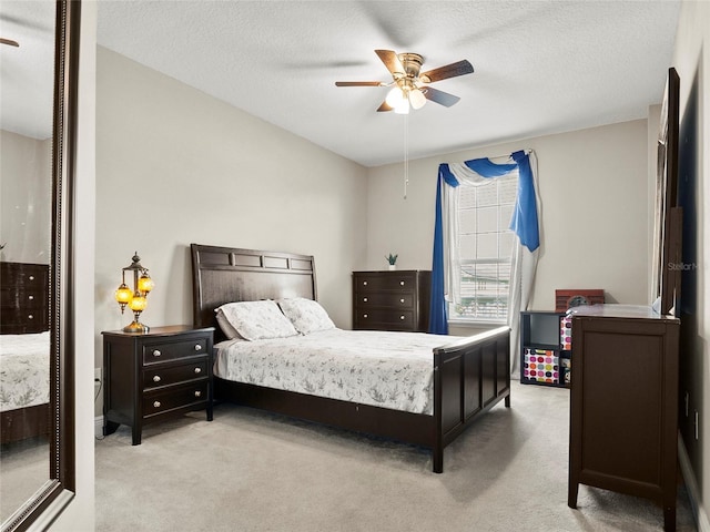 bedroom featuring ceiling fan and carpet floors
