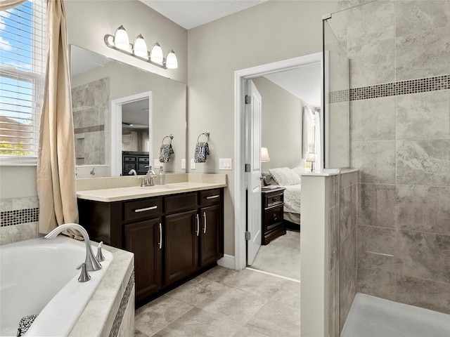full bathroom featuring ensuite bathroom, a bath, vanity, tile patterned flooring, and tiled shower