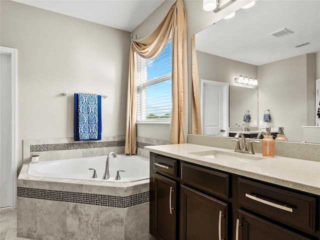 full bathroom with a bath, vanity, tile patterned flooring, and visible vents
