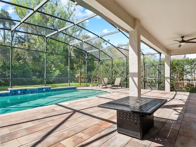 pool with a patio area, a lanai, and ceiling fan