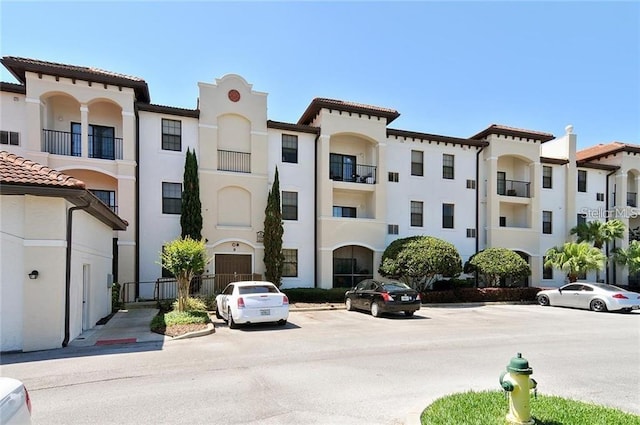 5550 E Michigan St Unit 2114, Orlando, FL 32822 - view of property featuring uncovered parking