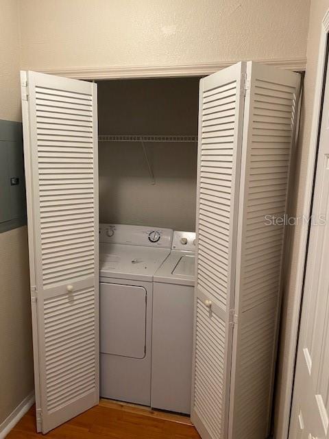 5550 E Michigan St Unit 2114, Orlando, FL 32822 - clothes washing area featuring washer and clothes dryer, light wood-style floors, and laundry area