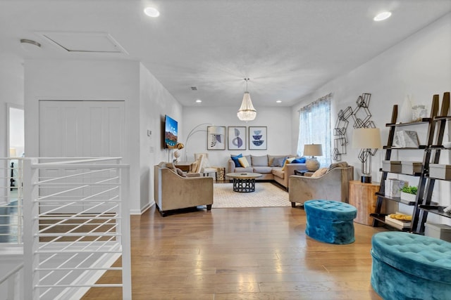 living room featuring recessed lighting and hardwood / wood-style flooring