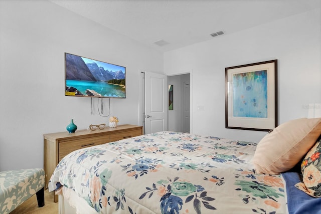 bedroom with visible vents and carpet floors