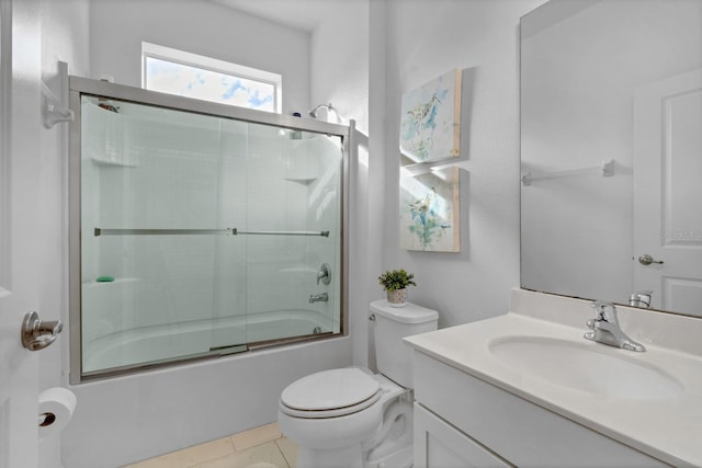 full bathroom with tile patterned floors, enclosed tub / shower combo, toilet, and vanity