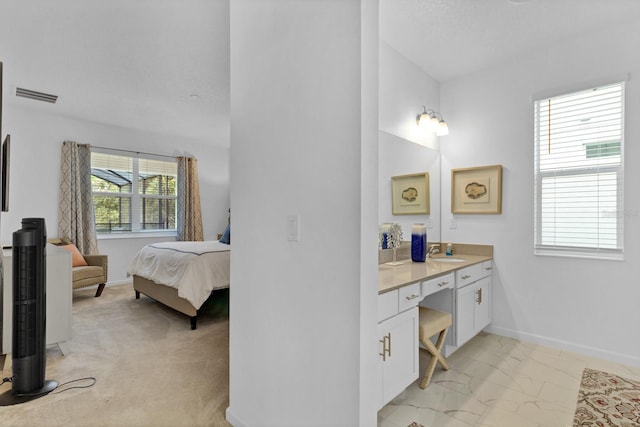 ensuite bathroom featuring baseboards, ensuite bath, visible vents, and marble finish floor