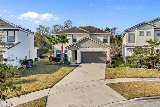 view of front of property with concrete driveway, a garage, and a front lawn