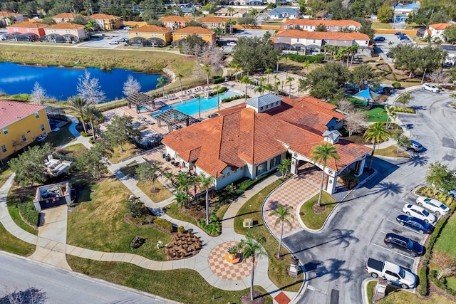 birds eye view of property featuring a water view and a residential view