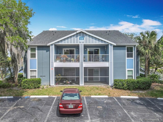 view of property featuring uncovered parking