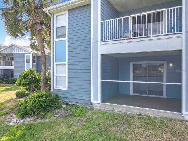 view of side of property featuring a balcony