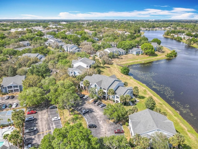 birds eye view of property with a residential view and a water view
