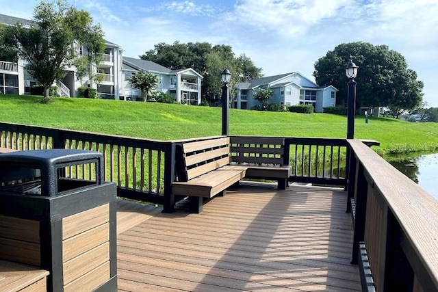 wooden deck with a residential view and a yard