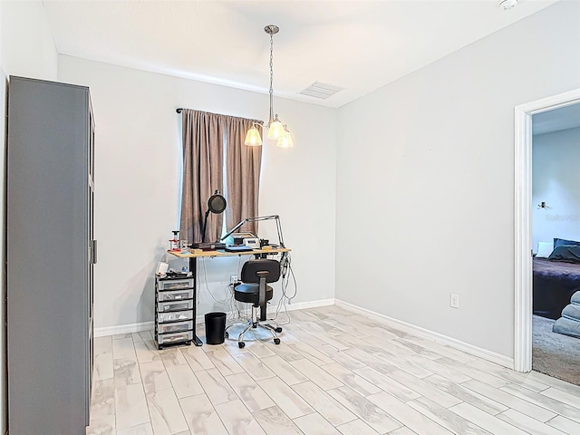 office space featuring light wood-style flooring and baseboards