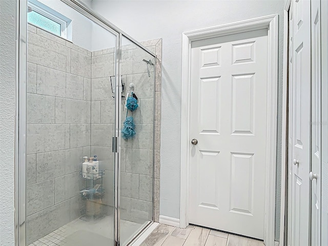 full bath featuring a stall shower