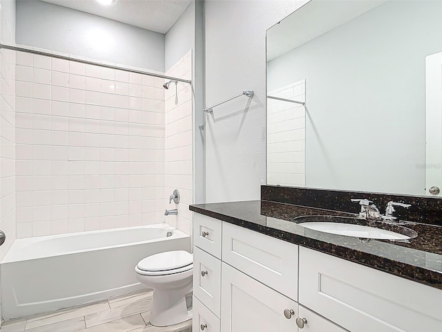 bathroom featuring shower / tub combination, vanity, toilet, and marble finish floor