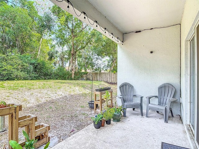 view of patio featuring fence