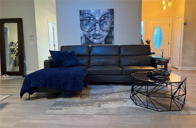 living room featuring wood finished floors and baseboards