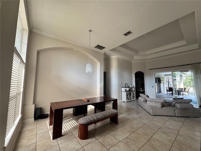dining area with visible vents, arched walkways, ornamental molding, and light tile patterned flooring