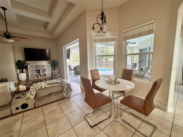 dining space with light tile patterned floors and a ceiling fan