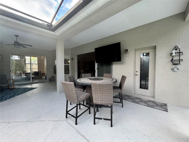 view of patio / terrace with ceiling fan and outdoor dining space