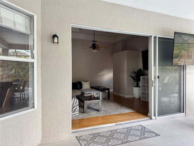 view of patio featuring ceiling fan