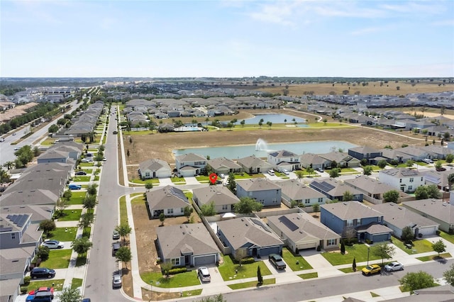 9005 Tuscan Cypress St, Kissimmee, FL 34747 - aerial perspective of suburban area featuring a large body of water