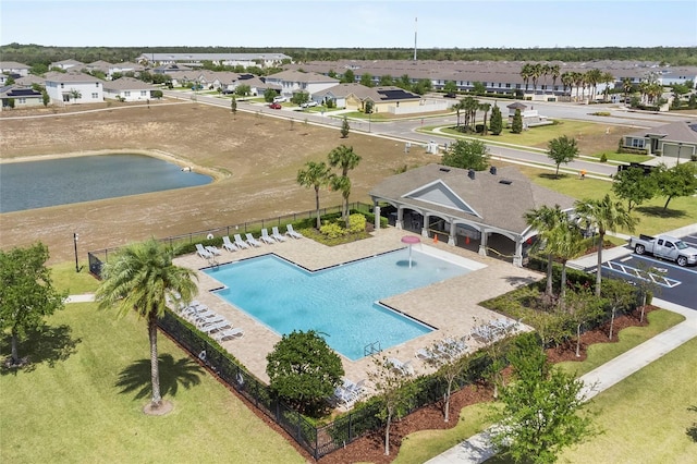 9005 Tuscan Cypress St, Kissimmee, FL 34747 - aerial view of residential area with a pool and a large body of water