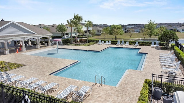 9005 Tuscan Cypress St, Kissimmee, FL 34747 - community pool with a patio and a residential view