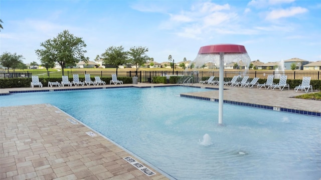 9005 Tuscan Cypress St, Kissimmee, FL 34747 - community pool with a patio area and a residential view