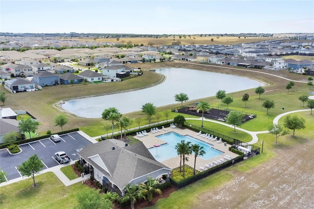 9005 Tuscan Cypress St, Kissimmee, FL 34747 - aerial perspective of suburban area with a large body of water and a pool area