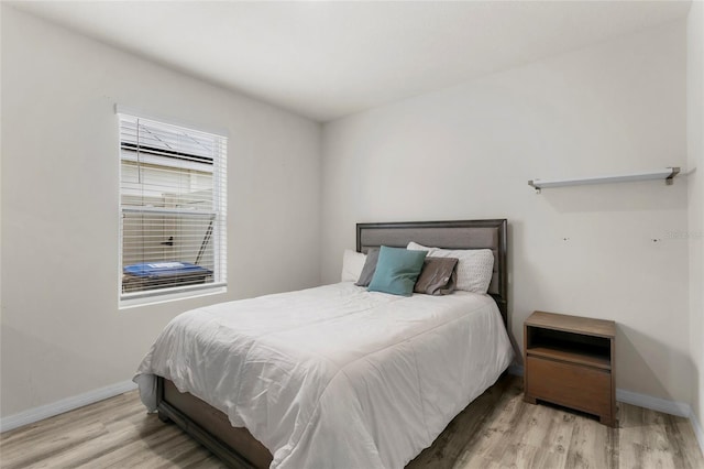 9005 Tuscan Cypress St, Kissimmee, FL 34747 - bedroom featuring wood finished floors and baseboards