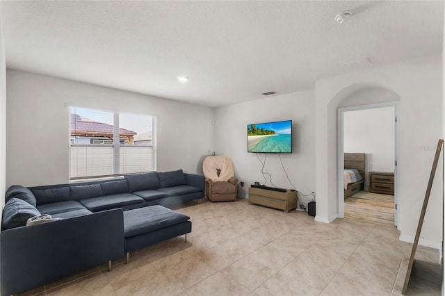 9005 Tuscan Cypress St, Kissimmee, FL 34747 - living area featuring light tile patterned floors and baseboards