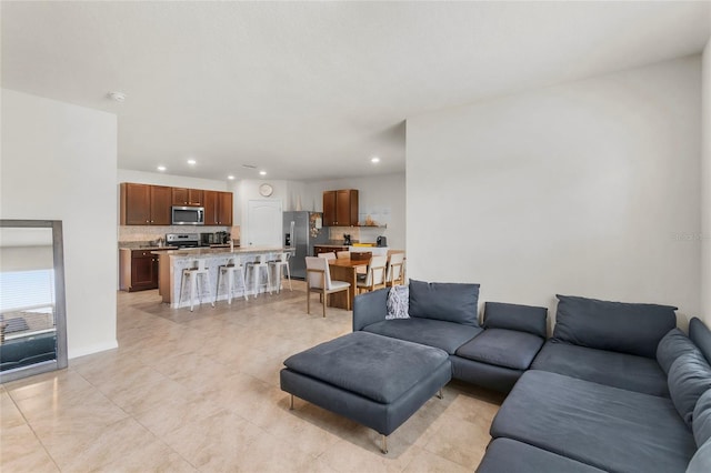 9005 Tuscan Cypress St, Kissimmee, FL 34747 - living room with recessed lighting and light tile patterned floors
