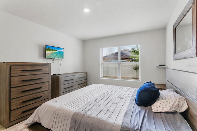 9005 Tuscan Cypress St, Kissimmee, FL 34747 - bedroom with light wood-style floors and recessed lighting
