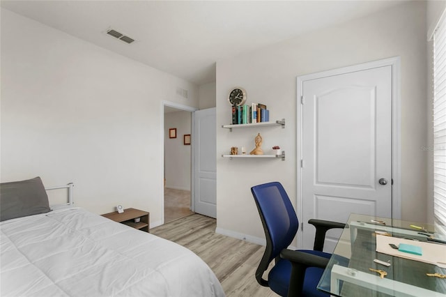 9005 Tuscan Cypress St, Kissimmee, FL 34747 - bedroom with light wood finished floors, an office area, and multiple windows