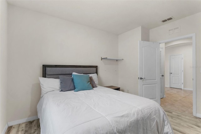 9005 Tuscan Cypress St, Kissimmee, FL 34747 - bedroom featuring wood finished floors and baseboards