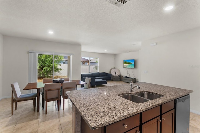 9005 Tuscan Cypress St, Kissimmee, FL 34747 - kitchen with dishwasher, an island with sink, light stone countertops, open floor plan, and recessed lighting
