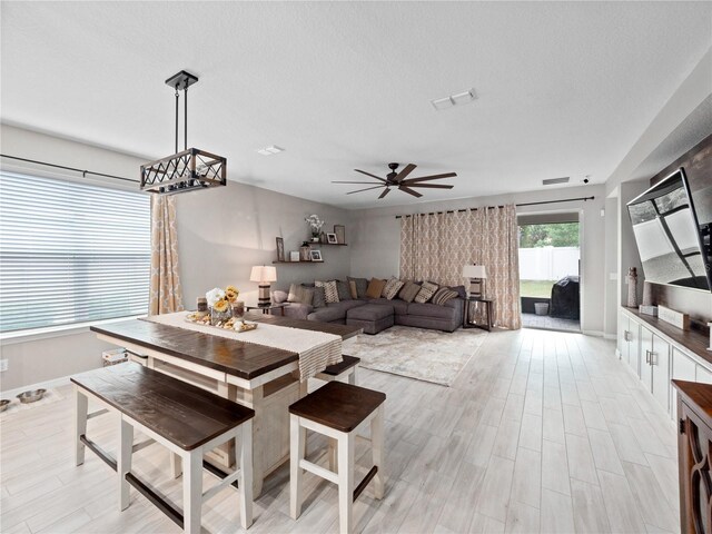 1151 Lakeside Estates Dr, Apopka, FL 32703 - dining space with visible vents, ceiling fan, and light wood-type flooring