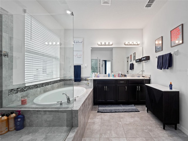 1151 Lakeside Estates Dr, Apopka, FL 32703 - bathroom with tile patterned floors, vanity, a bath, and visible vents